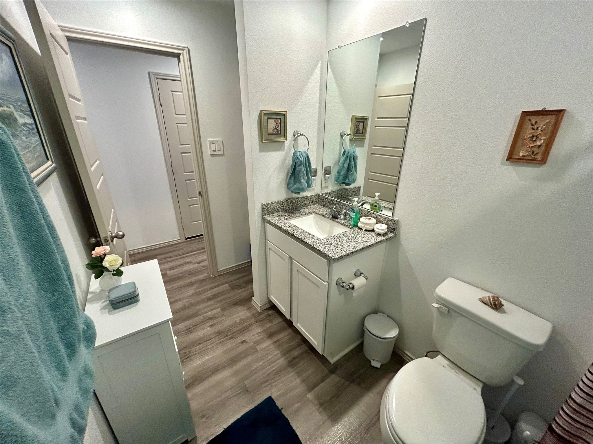6515 Alexis Street Beaumont, TX 77708 - Photo 21 of 36 a white toilet sitting next to a bathroom sink