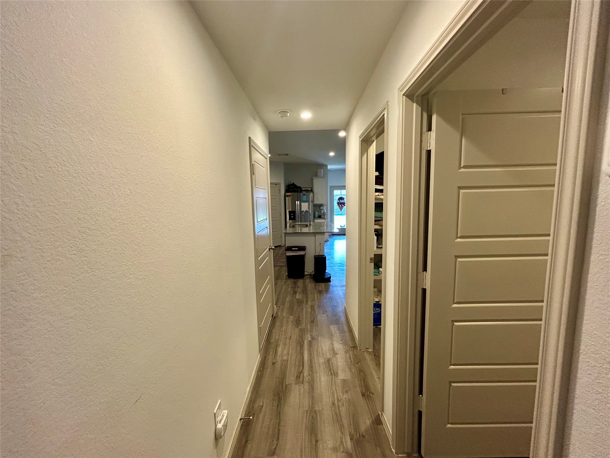 6515 Alexis Street Beaumont, TX 77708 - Photo 26 of 36 a view of a hallway with wooden floor and living room