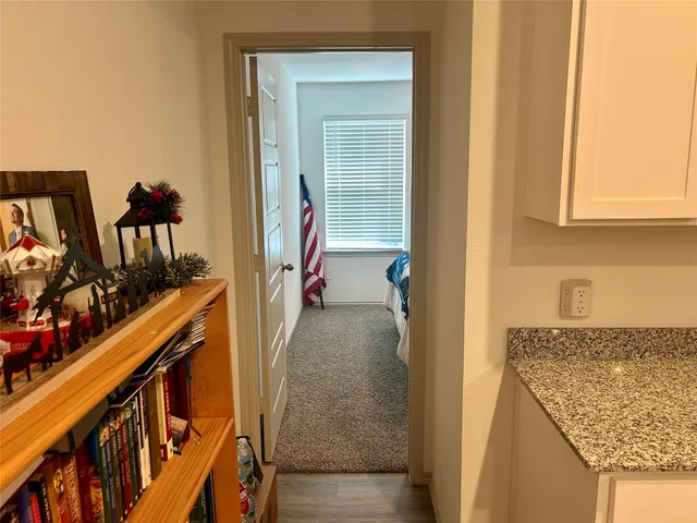 a bedroom with a bed and a chair