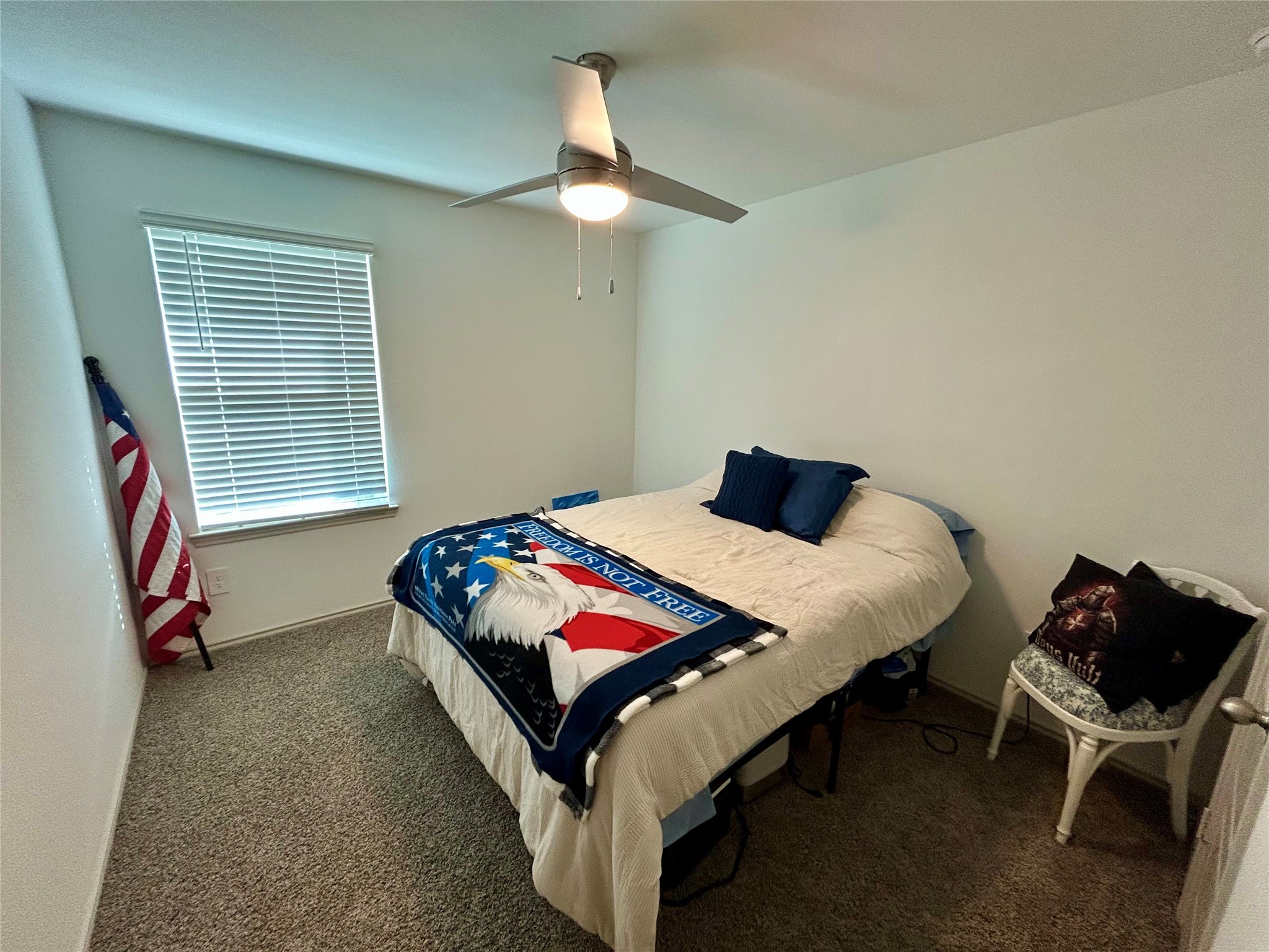 6515 Alexis Street Beaumont, TX 77708 - Photo 29 of 36 a bedroom with a bed and a chair