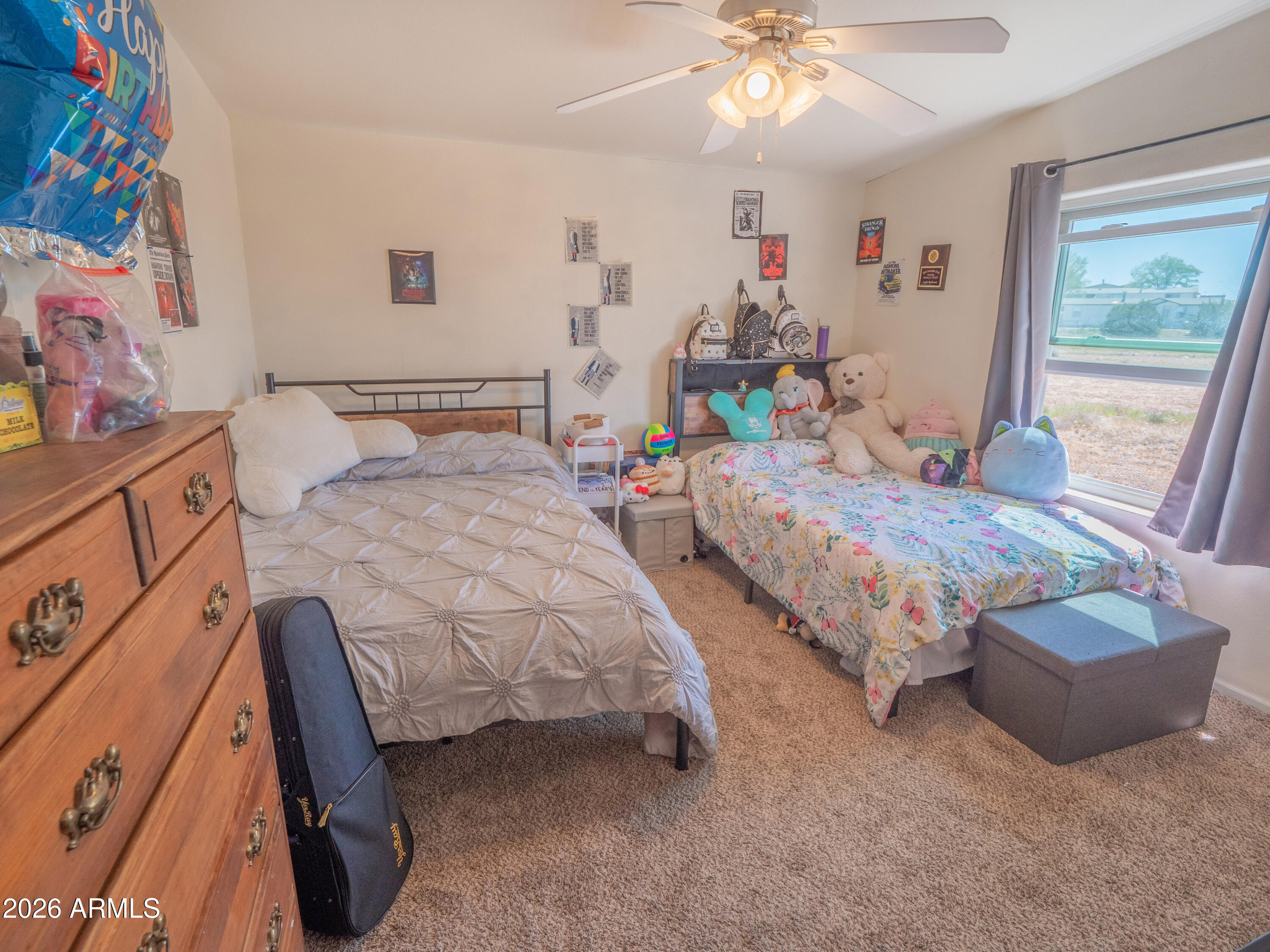 1401 Ranch Road Taylor, AZ 85939 - Photo 40 of 61 a bedroom with two beds and a chandelier