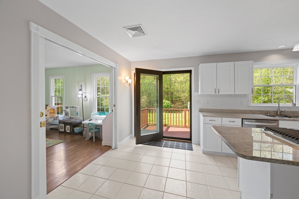 203 Richie Road Attleboro, MA 02703 - Photo 13 of 42 a kitchen with a sink and living room
