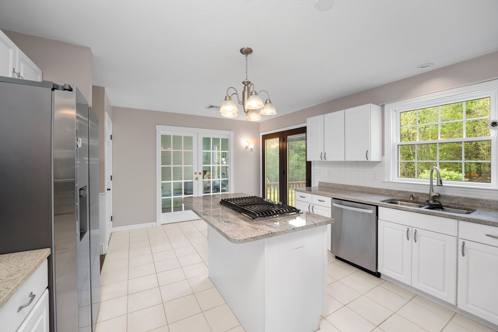 203 Richie Road Attleboro, MA 02703 - Photo 14 of 42 a kitchen with granite countertop a sink stainless steel appliances and cabinets