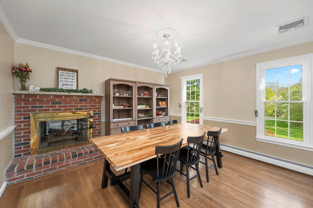 203 Richie Road Attleboro, MA 02703 - Photo 16 of 42 a view of a dining room with furniture window and wooden floor