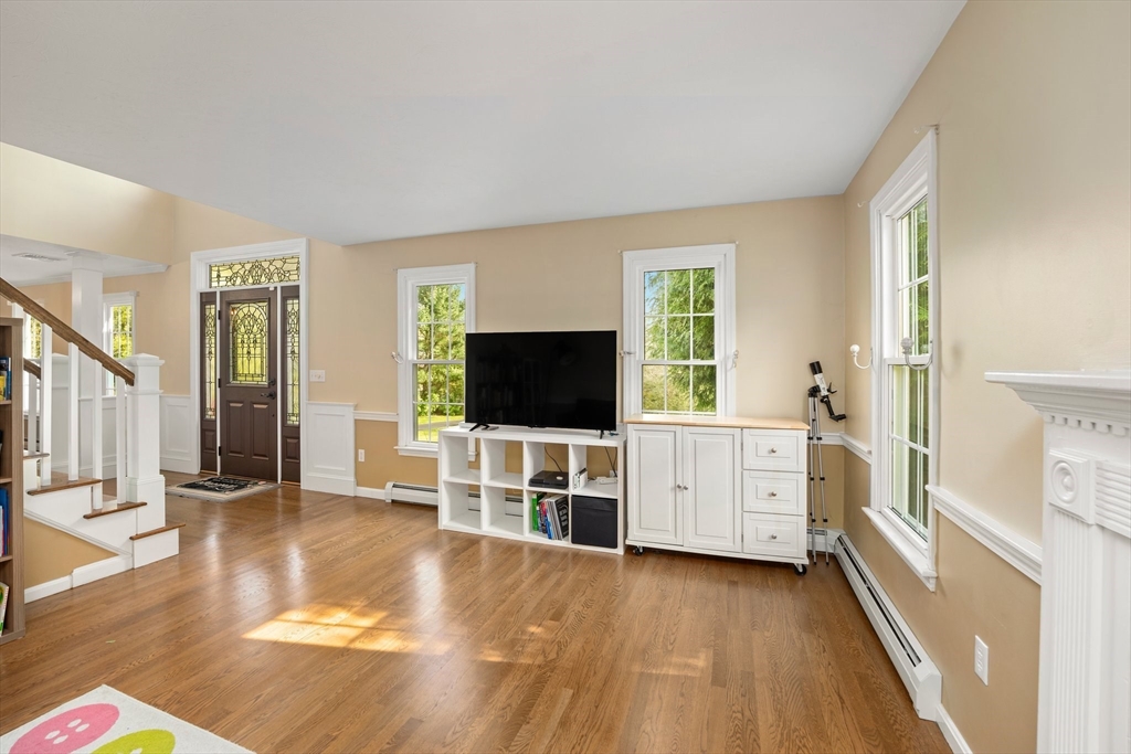 203 Richie Road Attleboro, MA 02703 - Photo 17 of 42 a view of a livingroom with furniture and a flat screen tv