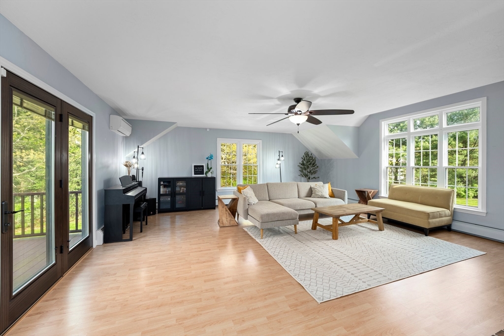 203 Richie Road Attleboro, MA 02703 - Photo 20 of 42 a living room with furniture and large windows