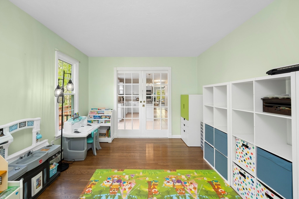 203 Richie Road Attleboro, MA 02703 - Photo 23 of 42 a large room with lots of wooden furniture and a rug
