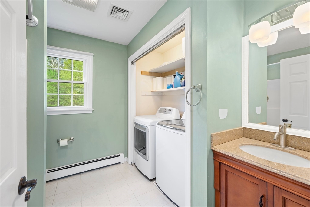 203 Richie Road Attleboro, MA 02703 - Photo 30 of 42 a utility room with a sink dryer and washer