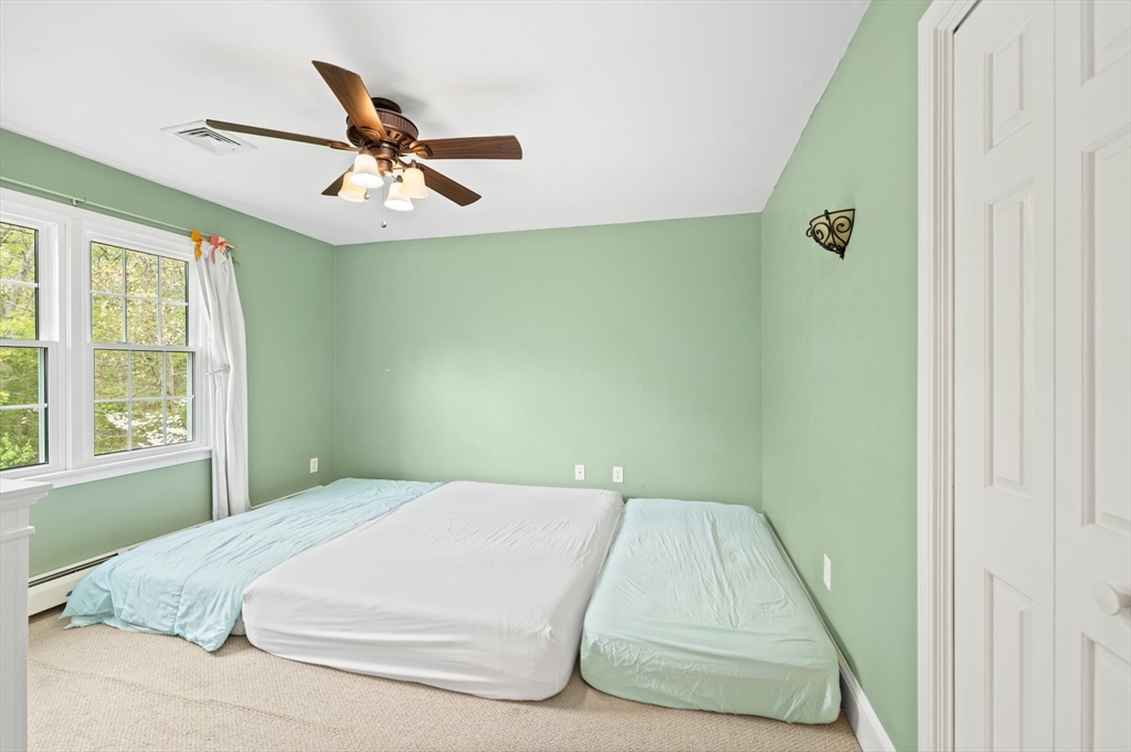 203 Richie Road Attleboro, MA 02703 - Photo 32 of 42 a bedroom with a bed and a window