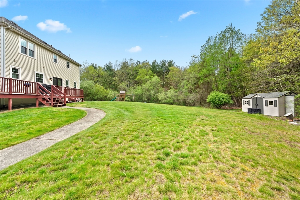 203 Richie Road Attleboro, MA 02703 - Photo 38 of 42 a view of a house with a yard and pathway