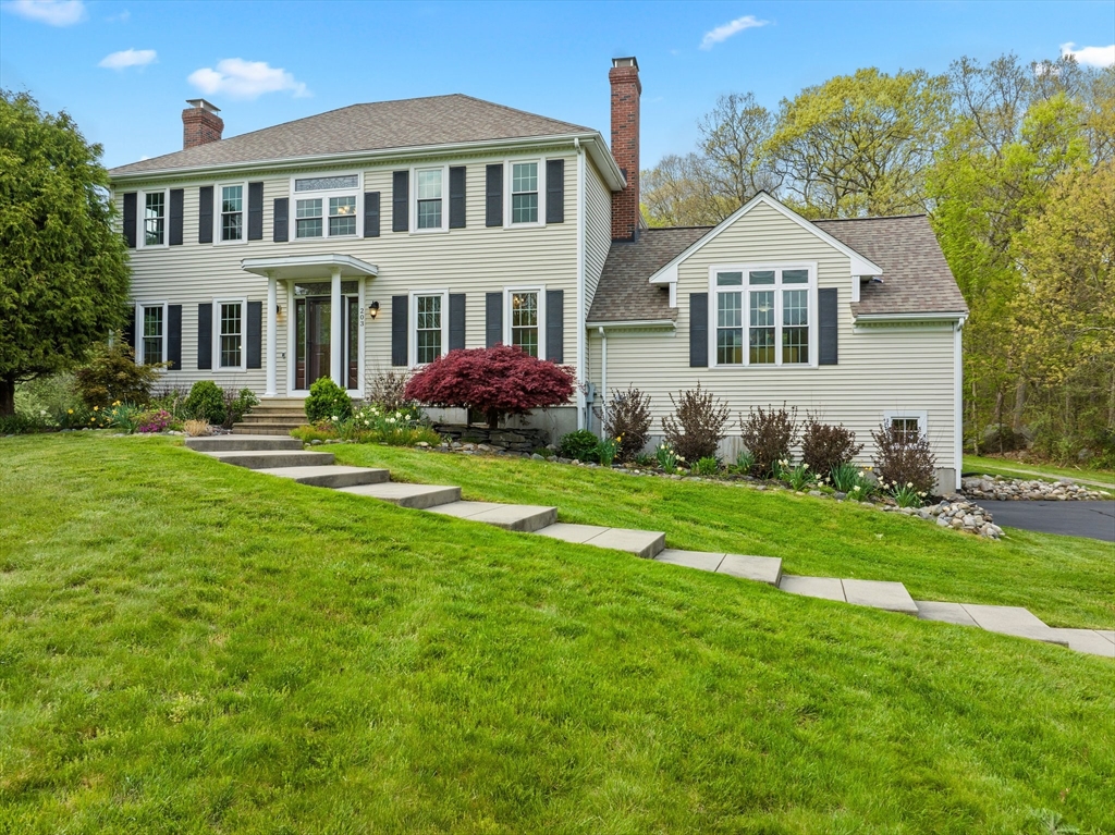 203 Richie Road Attleboro, MA 02703 - Photo 4 of 42 a front view of a house with a yard