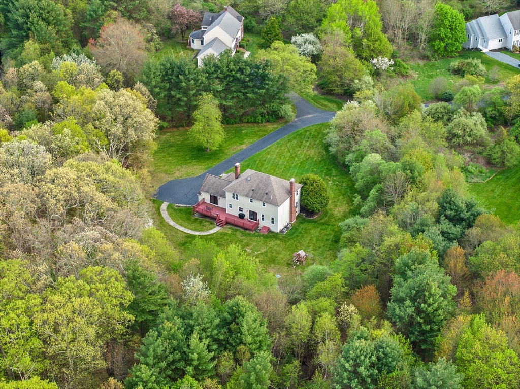 203 Richie Road Attleboro, MA 02703 - Photo 42 of 42 a backyard of a house with a garden and yard