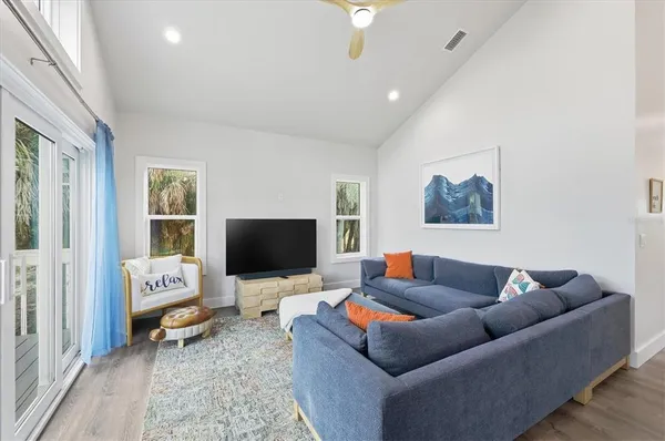 a large kitchen with a table and chairs