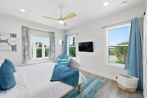 a bedroom with a bed and a couch