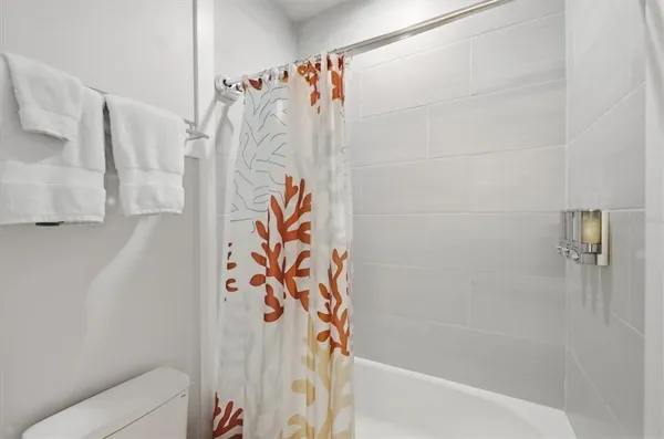 a view of a hallway with washer and dryer