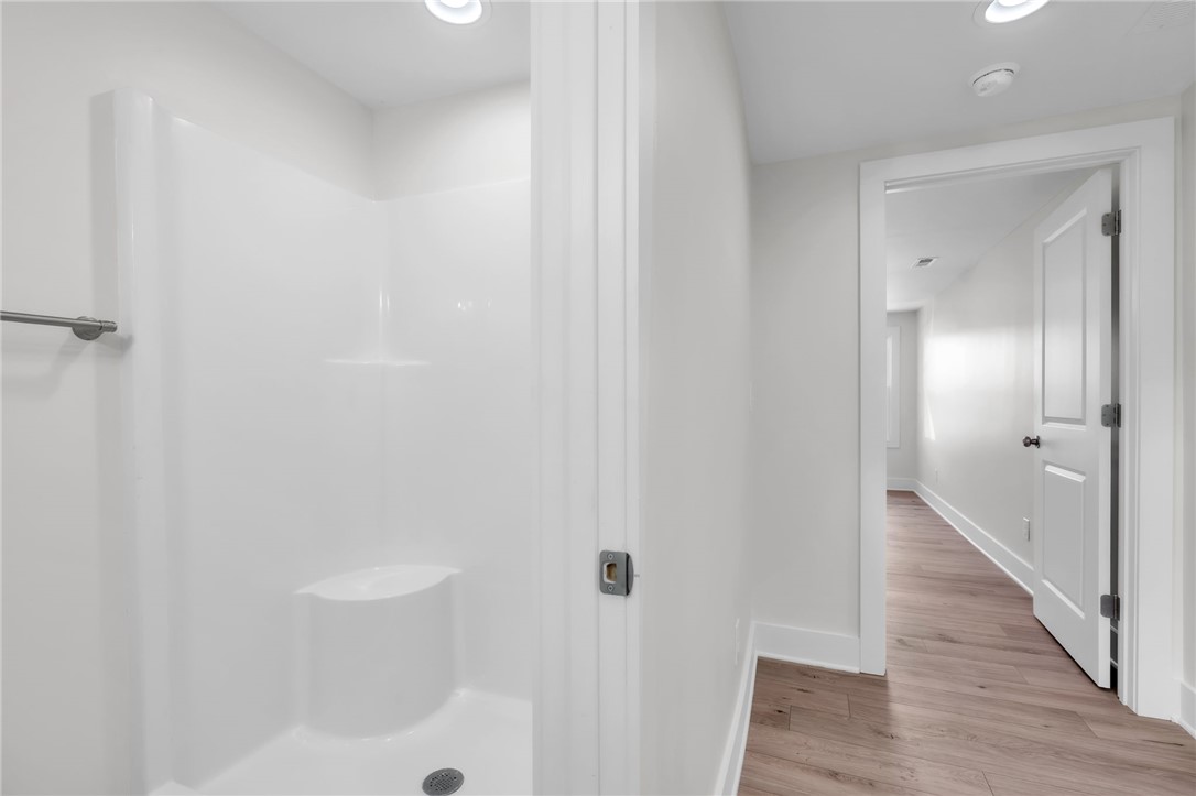 7 Beaverdam Road Williamston, SC 29697 - Photo 25 of 27 A well-appointed shower stall features a built-in seat and convenient grab bar.