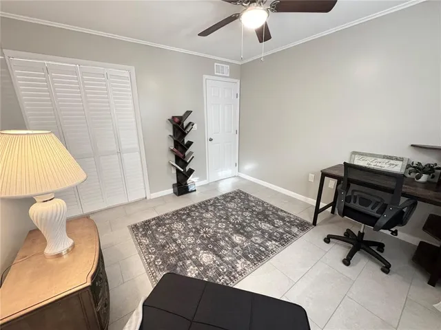 a view of a workspace with furniture and a couch