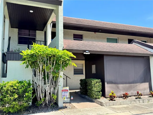a house with trees in front of it