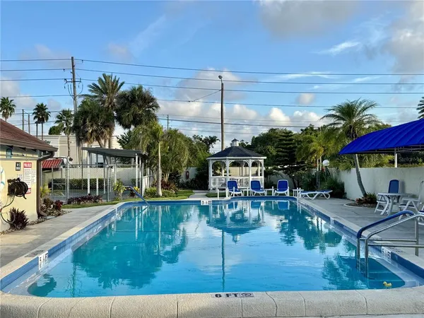 a view of a swimming pool with a patio