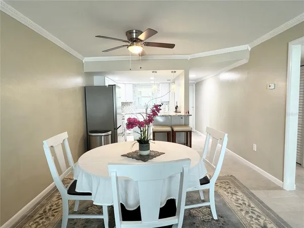 a dining room with furniture and window
