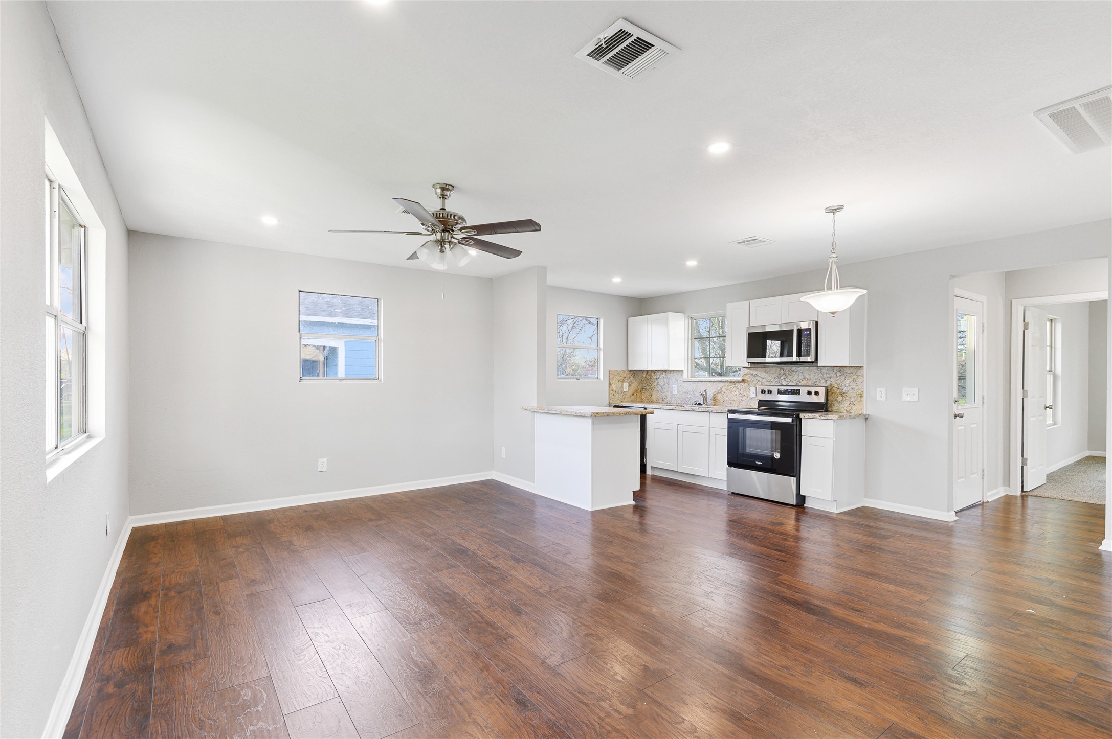 986 Dewalt Street Houston, TX 77088 - Photo 12 of 18 a view of kitchen with cabinets and wooden floor