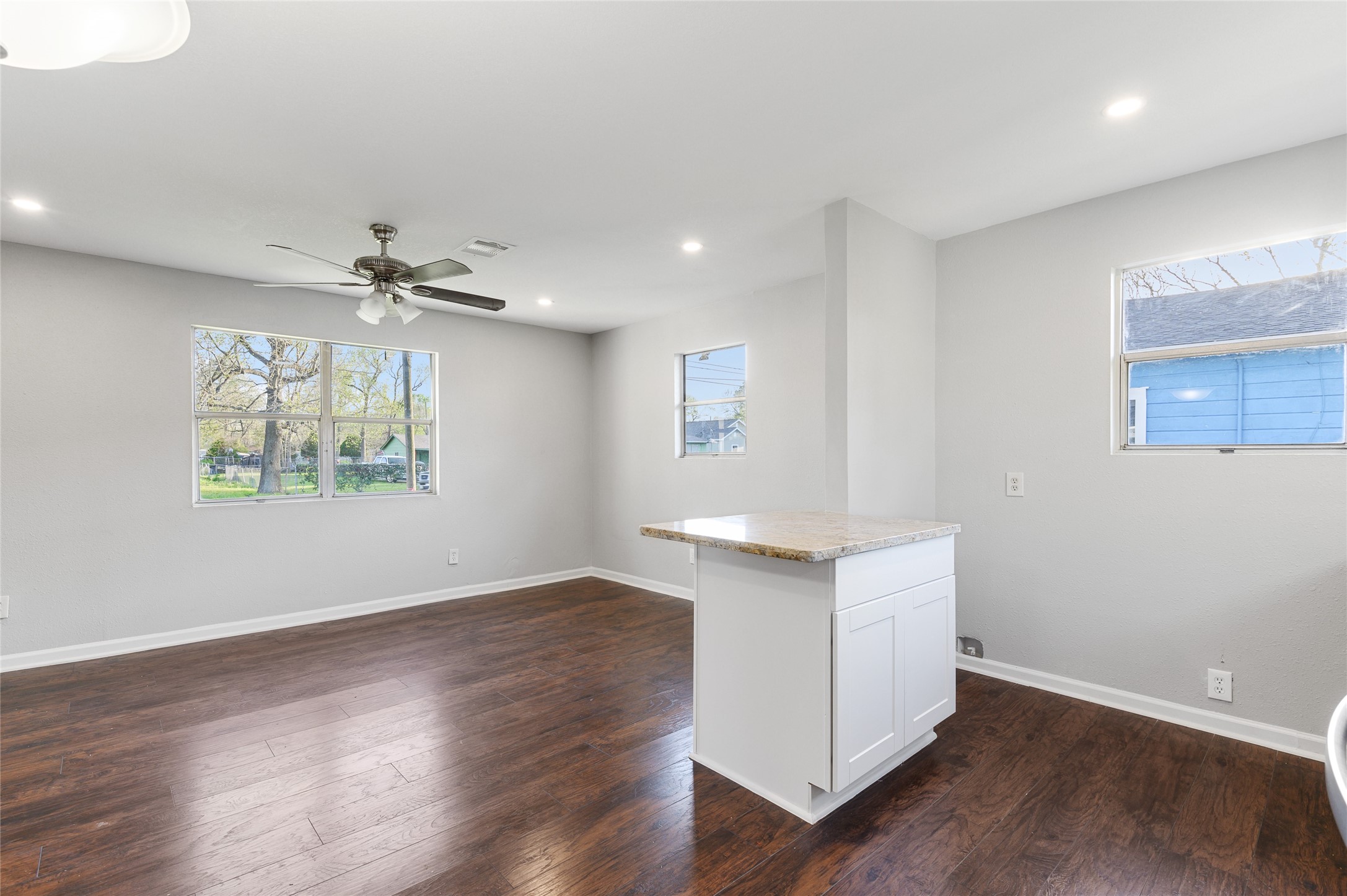 986 Dewalt Street Houston, TX 77088 - Photo 14 of 18 a view of an empty room with wooden floor and a window