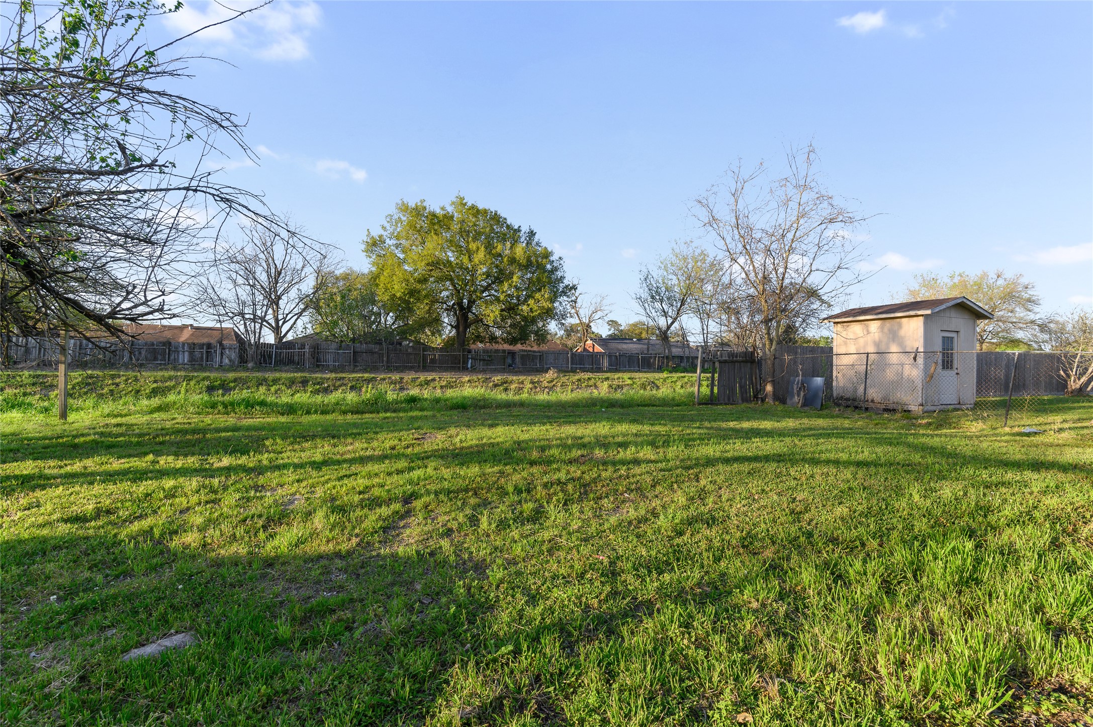 986 Dewalt Street Houston, TX 77088 - Photo 17 of 18 a view of a park with large trees