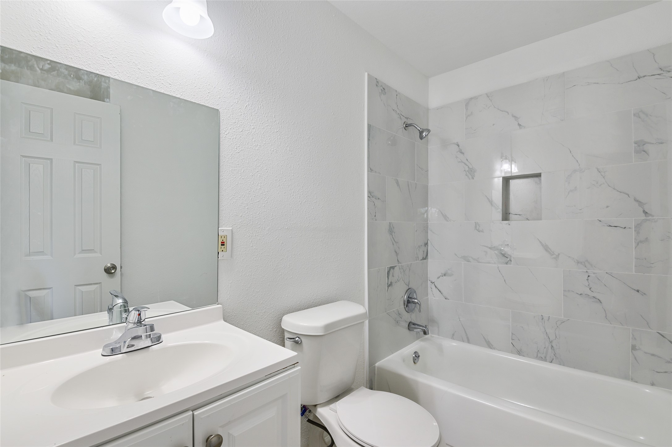 986 Dewalt Street Houston, TX 77088 - Photo 9 of 18 a bathroom with a sink toilet and shower