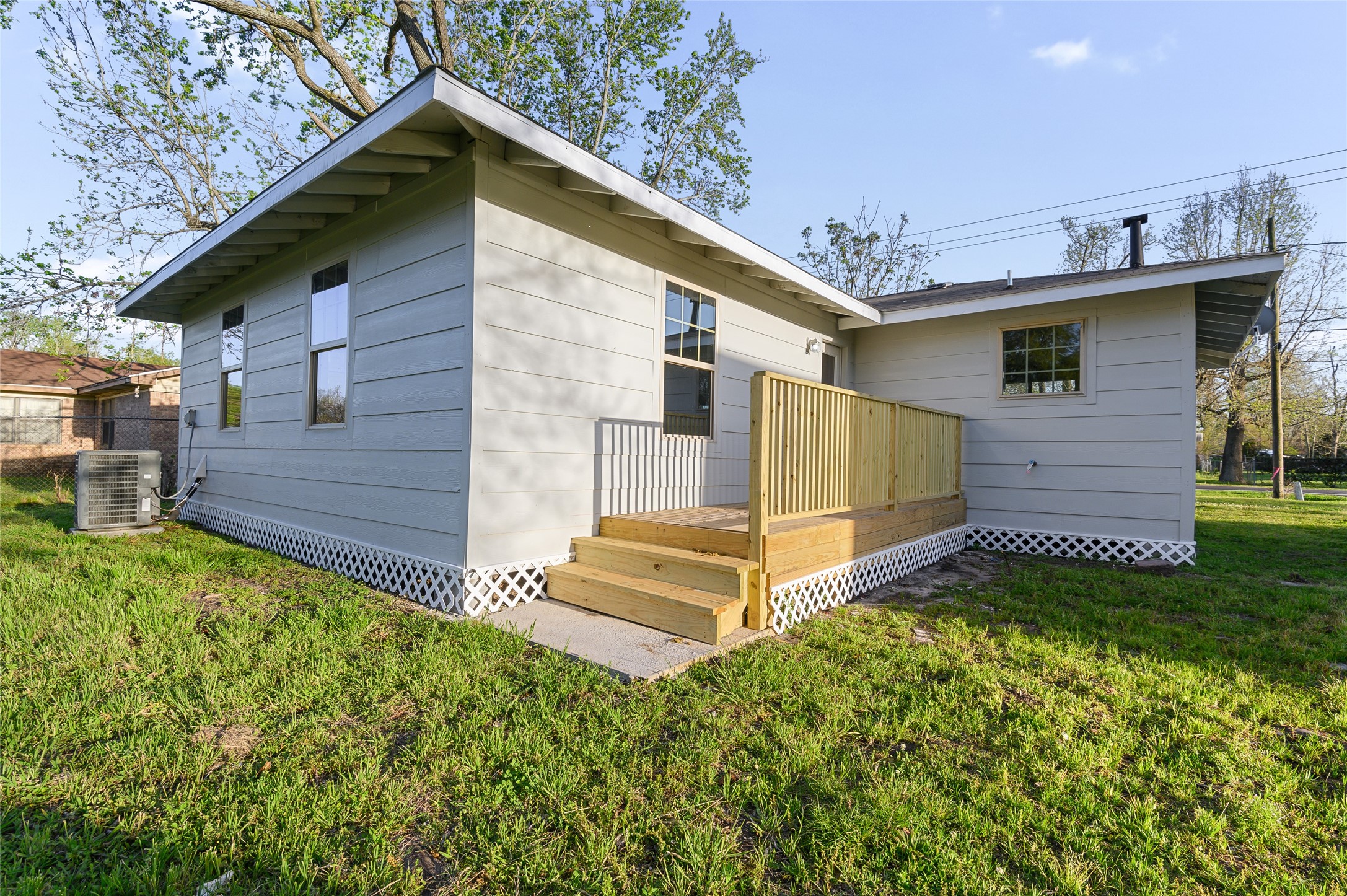 986 Dewalt Street Houston, TX 77088 - Photo 10 of 18 a view of a house with a yard