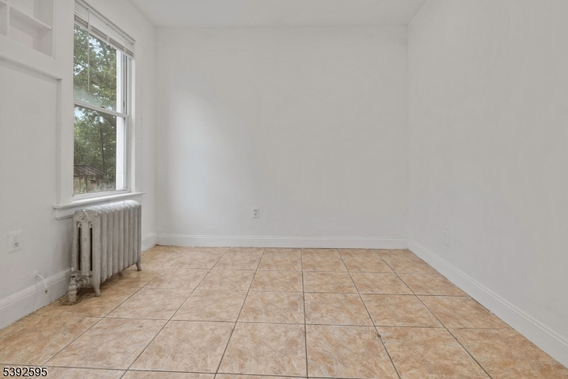 213 Maple Avenue Irvington, NJ 07111 - Photo 12 of 17 an empty room with windows