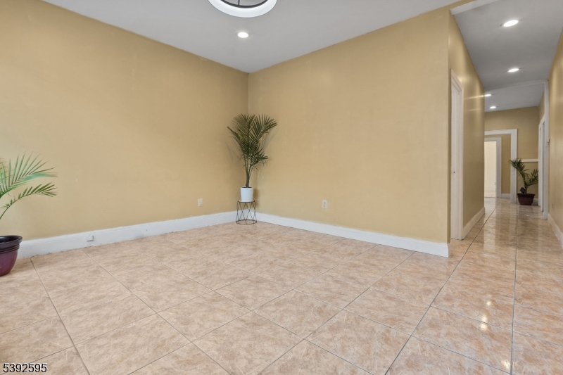 213 Maple Avenue Irvington, NJ 07111 - Photo 10 of 17 a view of a livingroom with a staircase