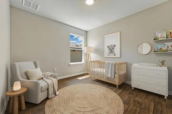 a bedroom with a bed and a dresser