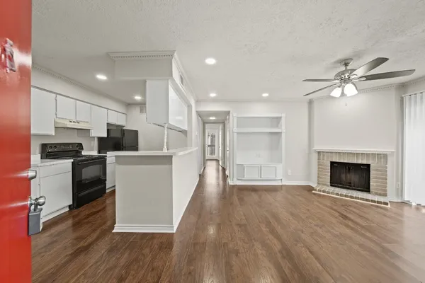 a view of kitchen with cabinets and wooden floor