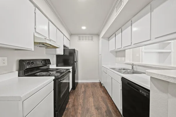 a kitchen with stainless steel appliances granite countertop a stove and a sink