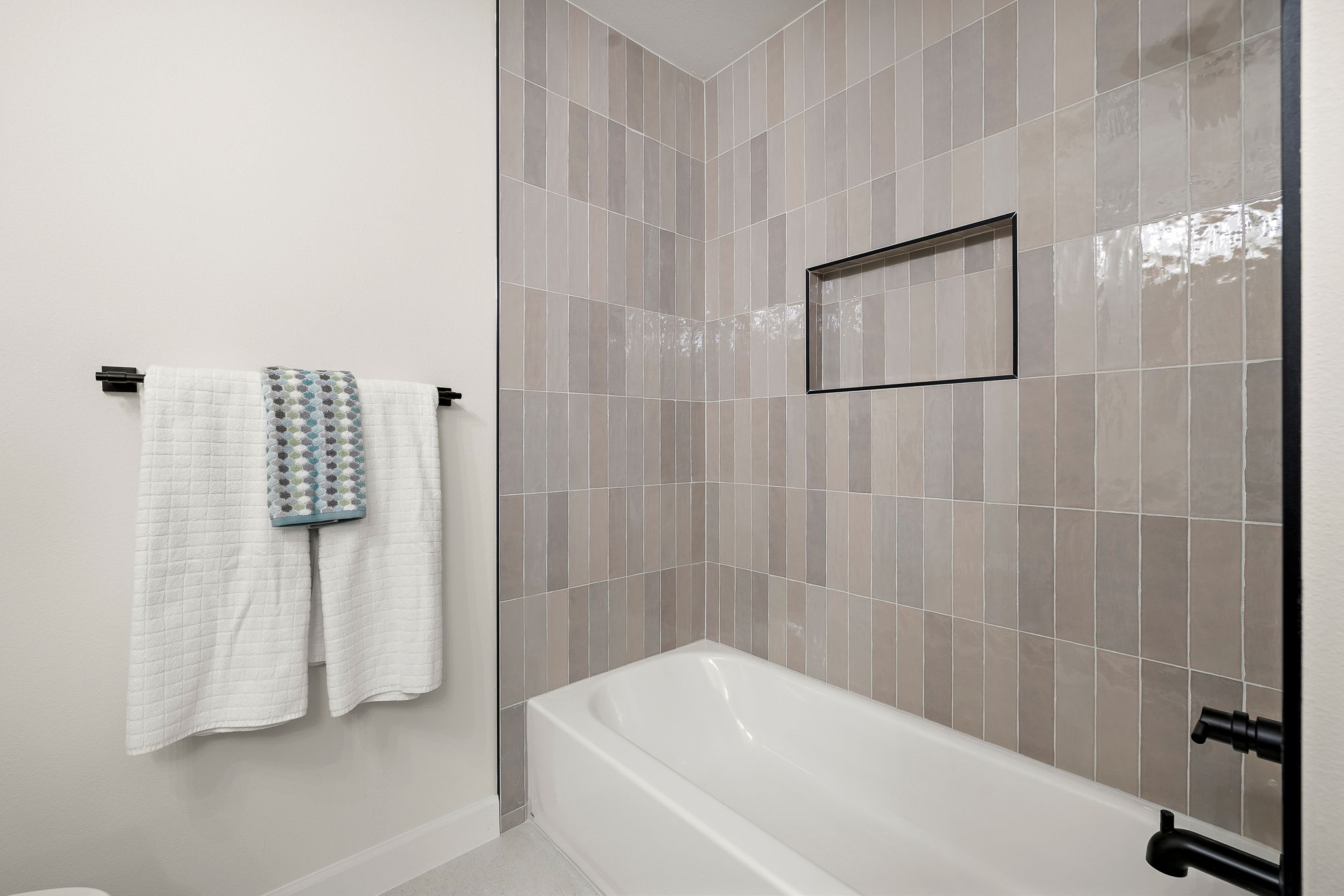 8102 Burrell Drive Austin, TX 78757 - Photo 28 of 35 a bathroom with a bathtub and shower