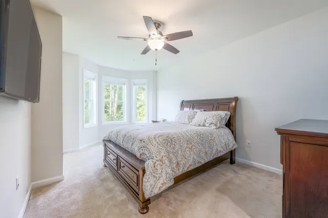 a bed room with a bed and a window