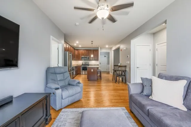 a living room with fireplace furniture and a flat screen tv