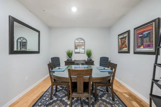 a view of a dining room with furniture window and wooden floor