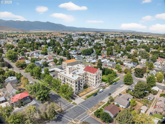 an aerial view of multiple houses with outdoor space