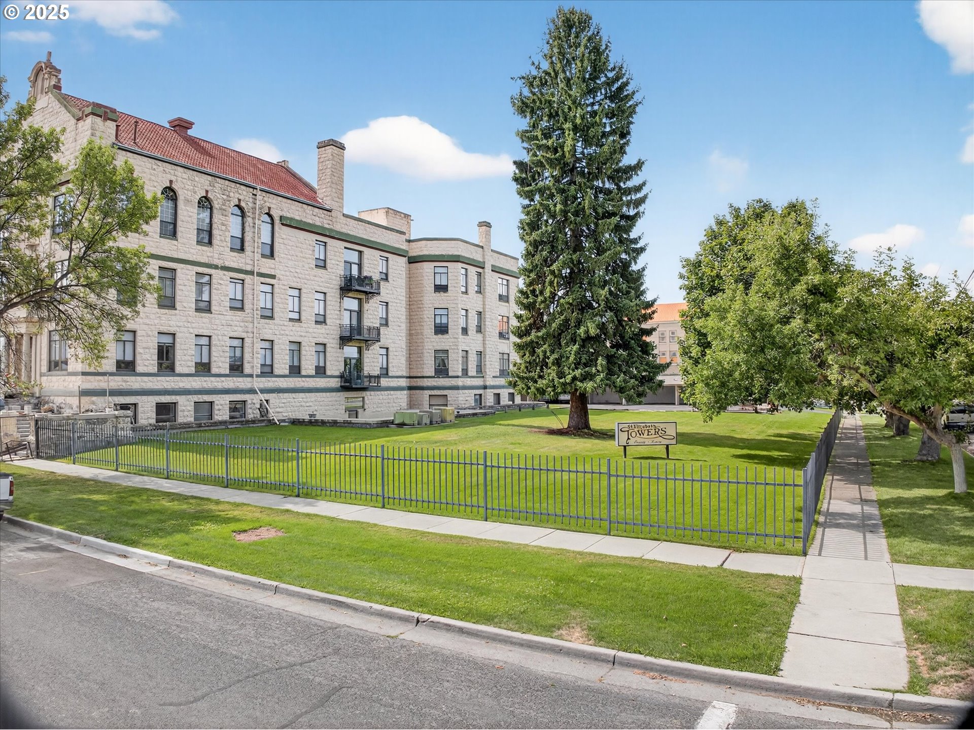 2365 4th Street, Unit 201 Baker City, OR 97814 - Photo 28 of 33 a view of a swimming pool with a big yard and large trees