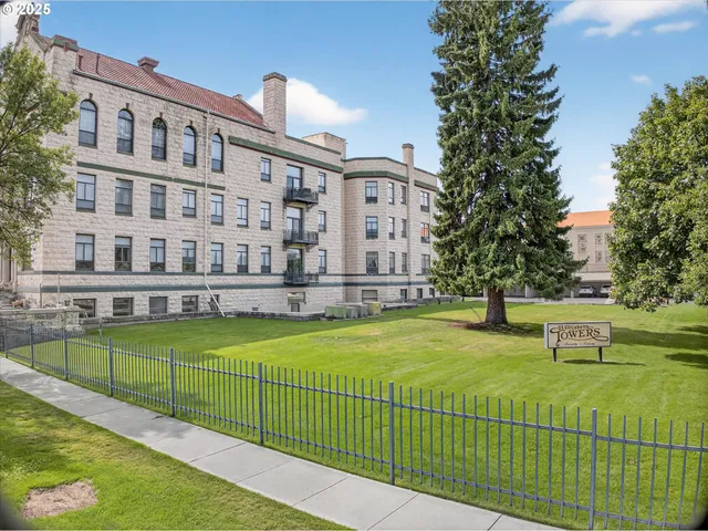 an aerial view of a house with a garden