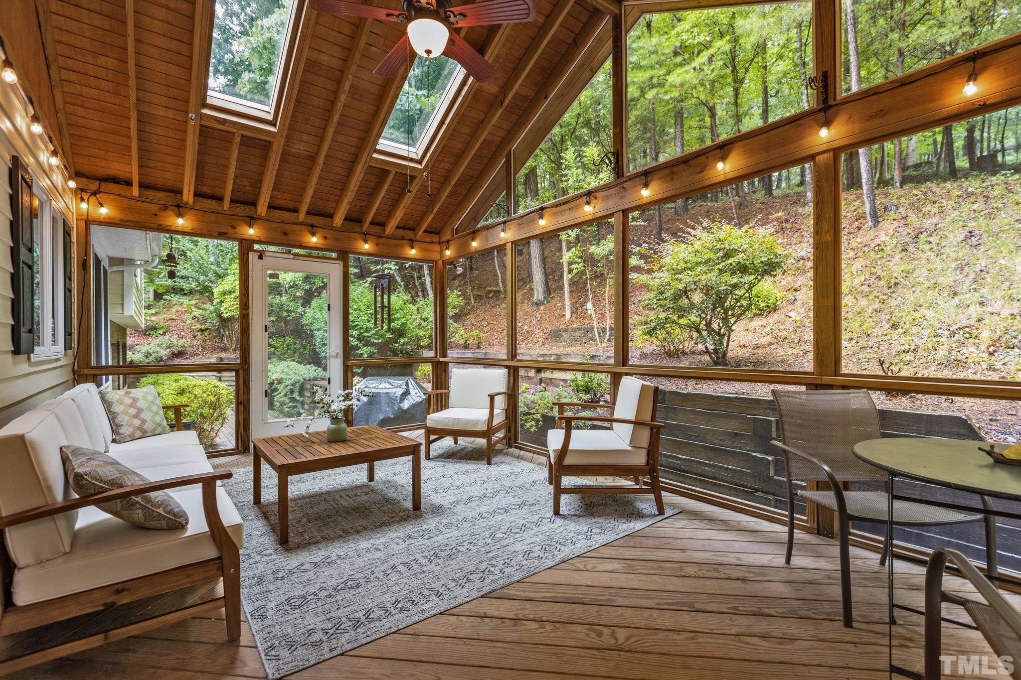 108 Rhododendron Court Chapel Hill, NC 27517 - Photo 1 of 38 a living room with furniture and a floor to ceiling window