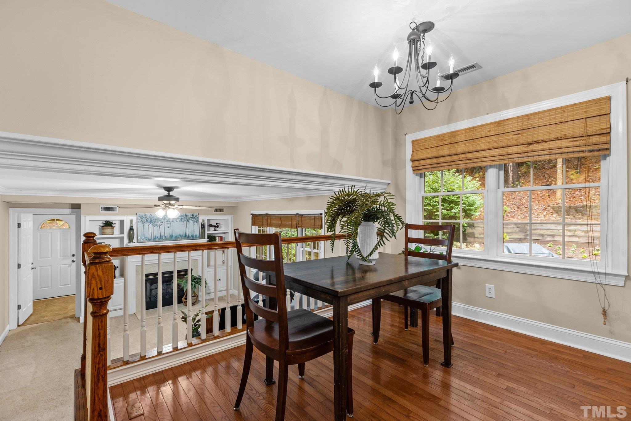 108 Rhododendron Court Chapel Hill, NC 27517 - Photo 12 of 38 a view of a dining room with furniture window and wooden floor