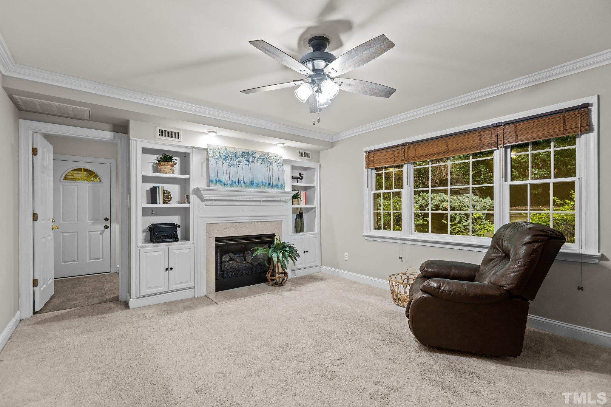 108 Rhododendron Court Chapel Hill, NC 27517 - Photo 14 of 38 a living room with furniture and a fireplace