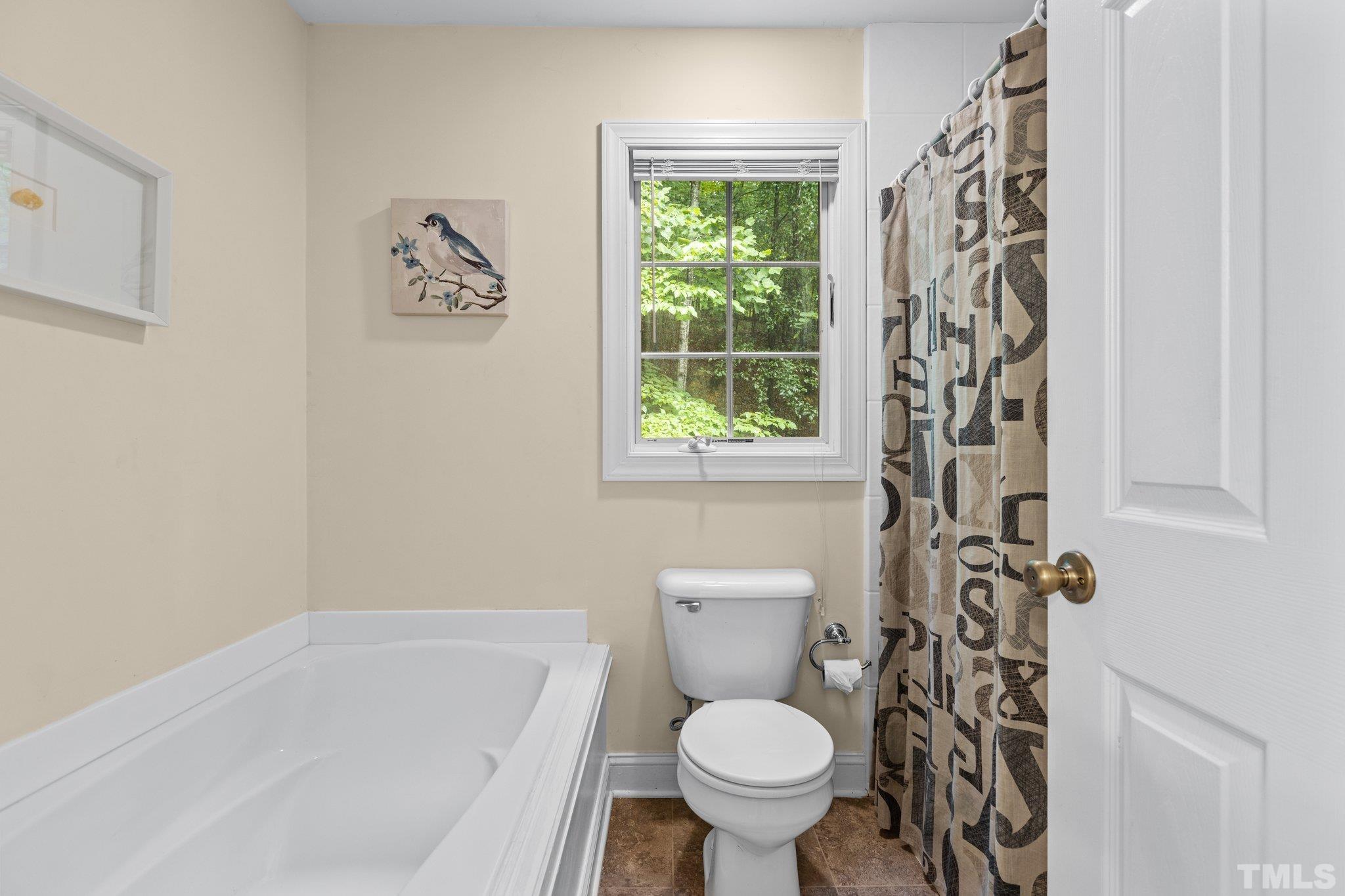 108 Rhododendron Court Chapel Hill, NC 27517 - Photo 19 of 38 a bathroom with a toilet sink and shower