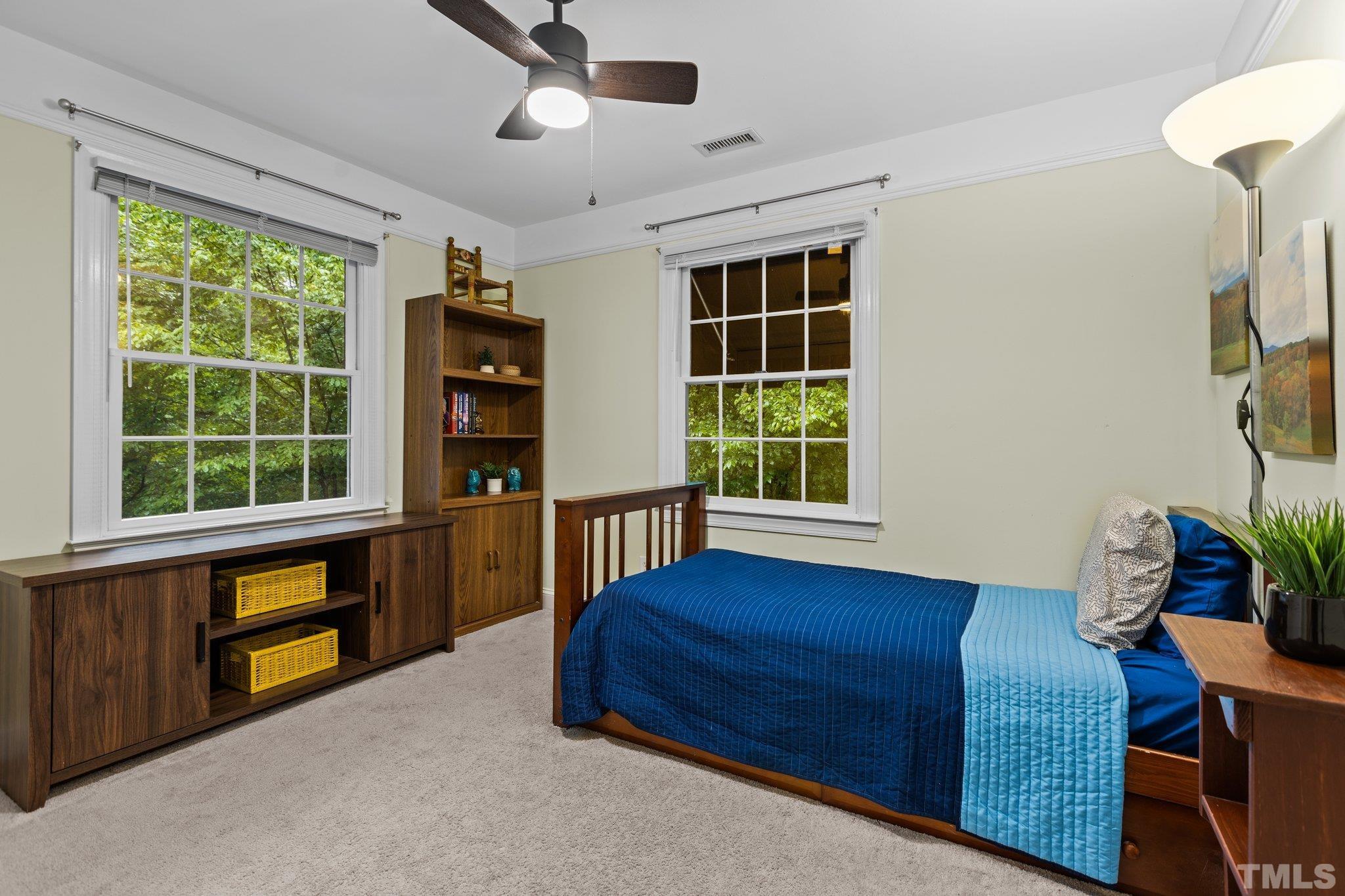 108 Rhododendron Court Chapel Hill, NC 27517 - Photo 22 of 38 a bedroom with furniture and a window