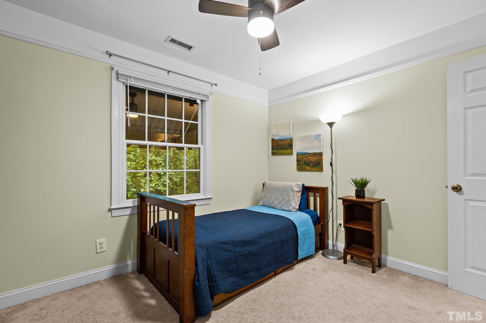 108 Rhododendron Court Chapel Hill, NC 27517 - Photo 23 of 38 a bedroom with a bed and a window
