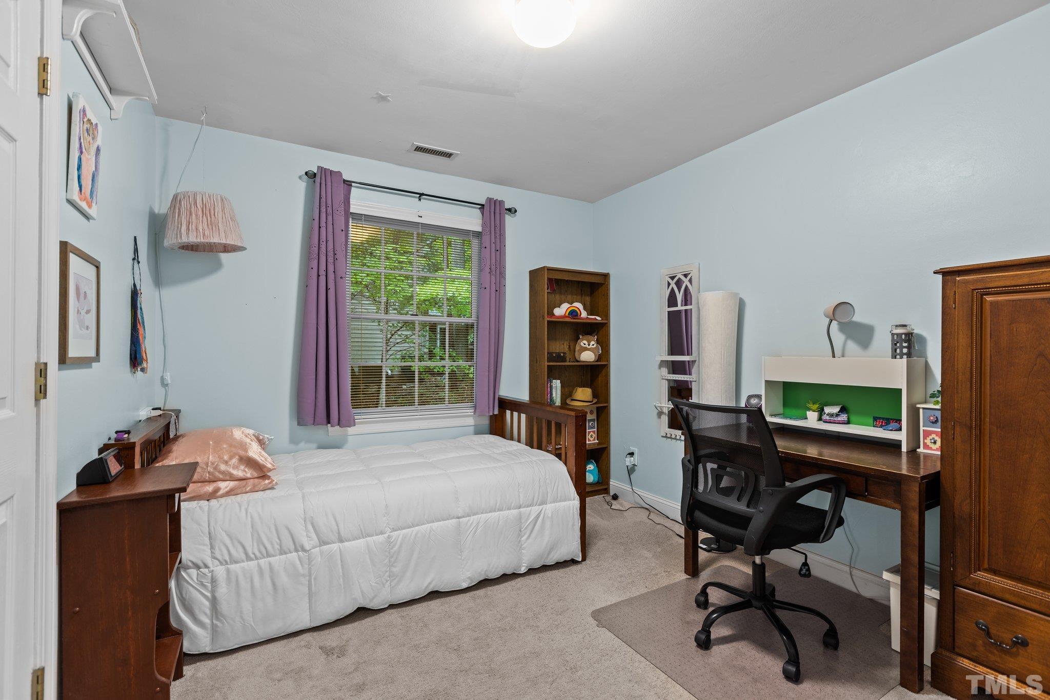 108 Rhododendron Court Chapel Hill, NC 27517 - Photo 24 of 38 a bedroom with furniture and a window