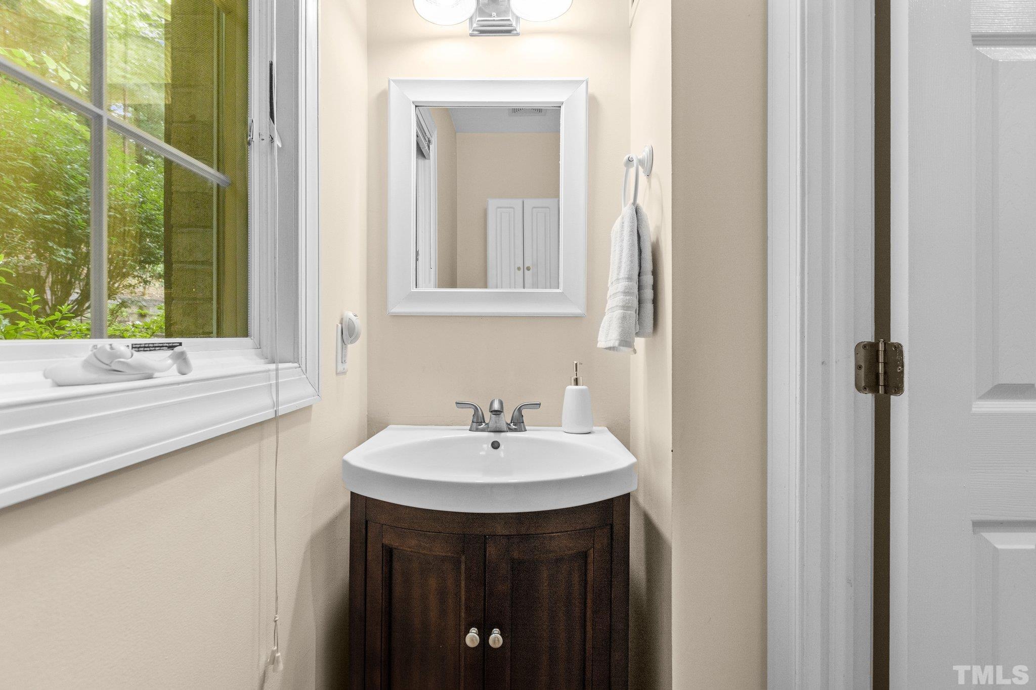 108 Rhododendron Court Chapel Hill, NC 27517 - Photo 26 of 38 a bathroom with a sink and a mirror