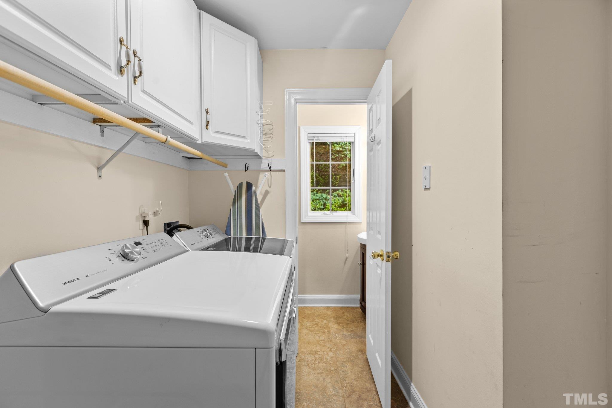 108 Rhododendron Court Chapel Hill, NC 27517 - Photo 27 of 38 a utility room with dryer and washer